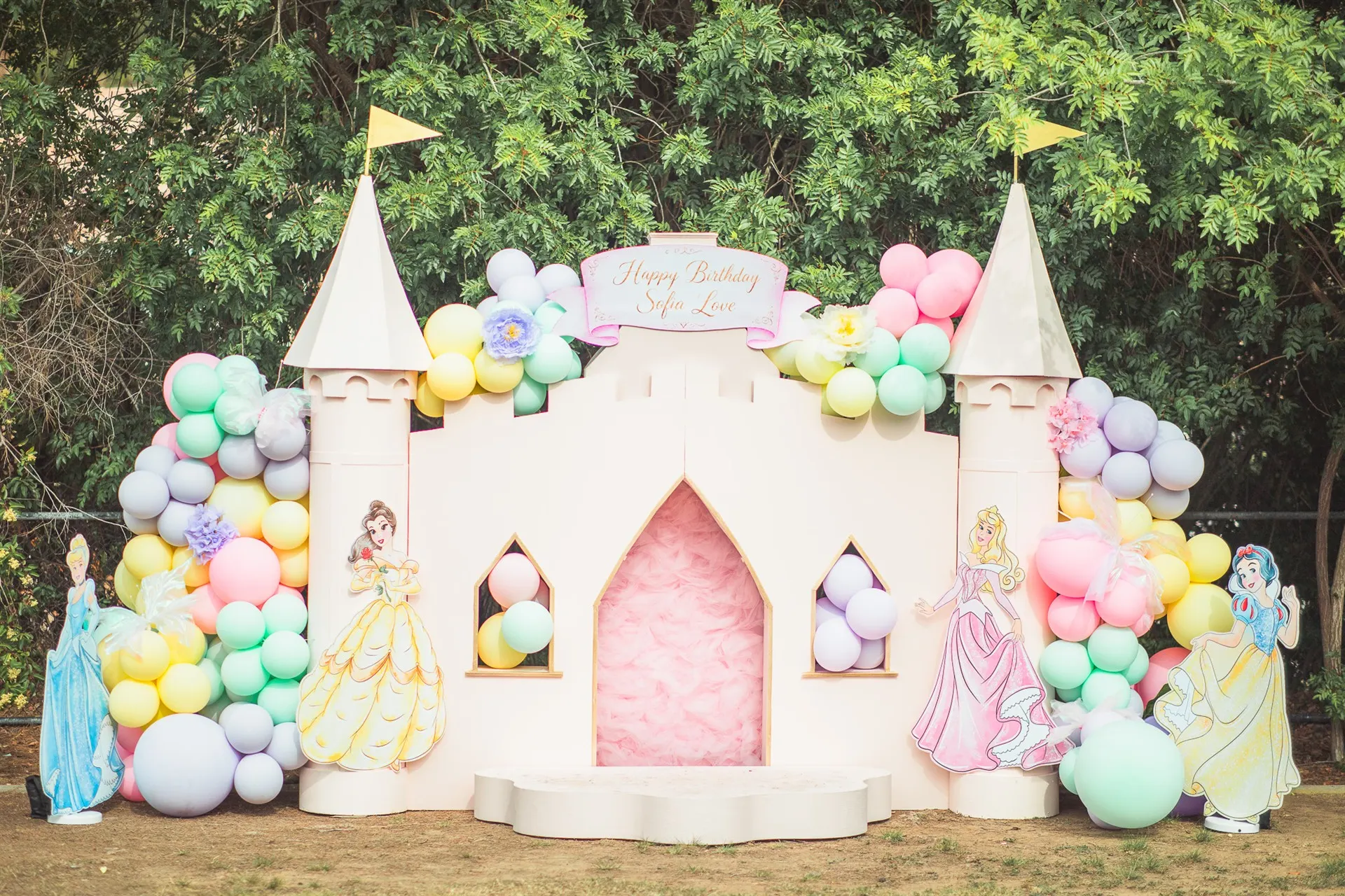 Princess castle birthday party decor with pastel balloons
